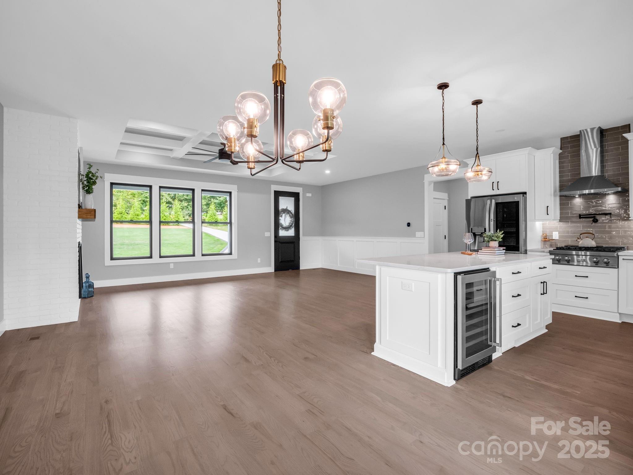 128 Gravely Branch Road Fletcher, NC 28732 - Photo 5 of 48 a kitchen with stainless steel appliances kitchen island granite countertop a stove a sink and a chandelier