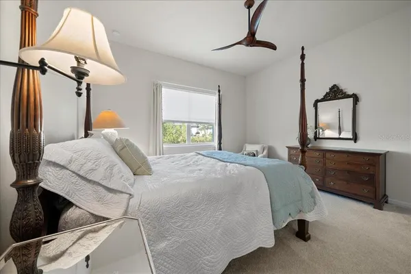 a spacious bathroom with a shower tub double sink and mirror