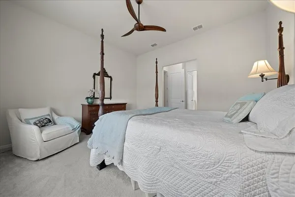 a view of walk in closet with clothes