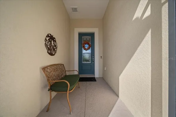 a view of a hallway with seating area