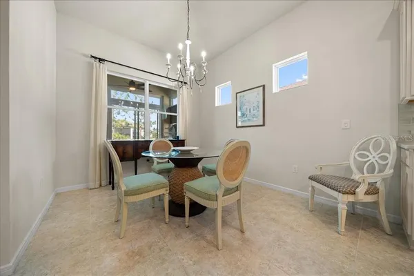 a living room with furniture a table and a flat screen tv