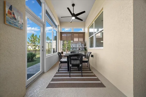 an aerial view of residential houses with outdoor space and swimming pool