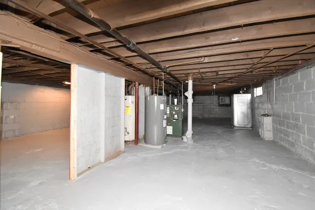 a view of empty room with wooden walls