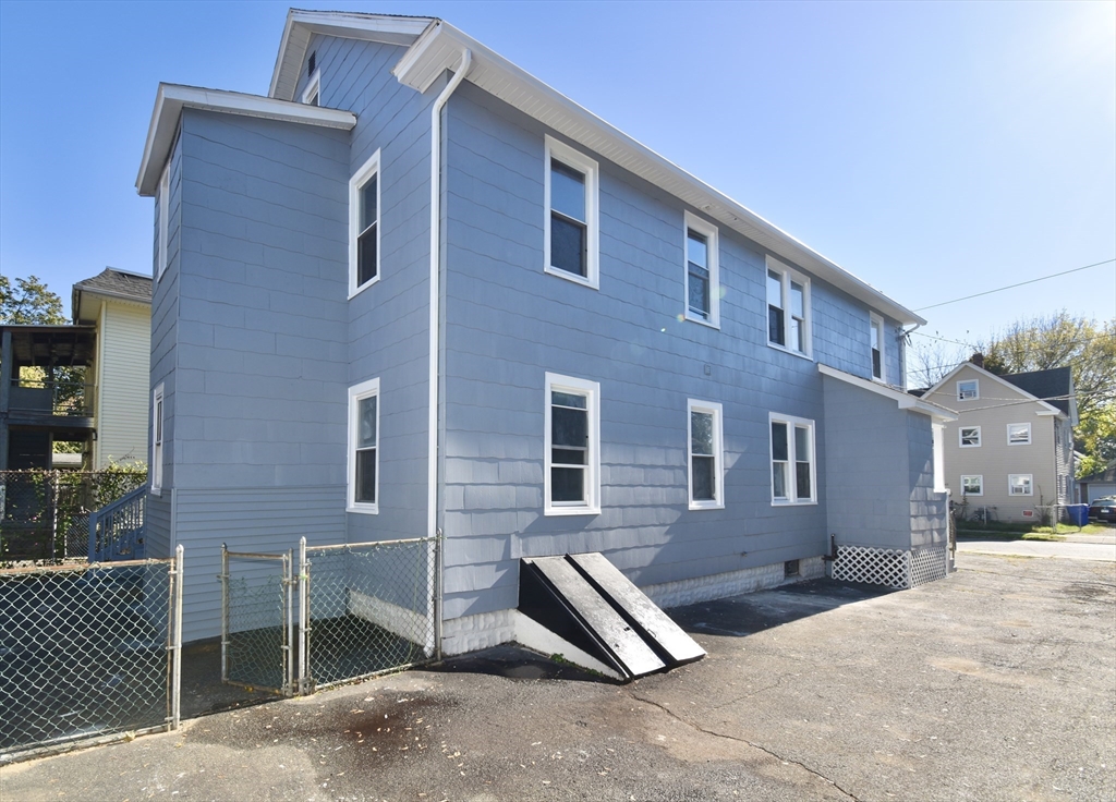 46-48 Wait Street Springfield, MA 01104 - Photo 4 of 40 a front view of a house with parking space