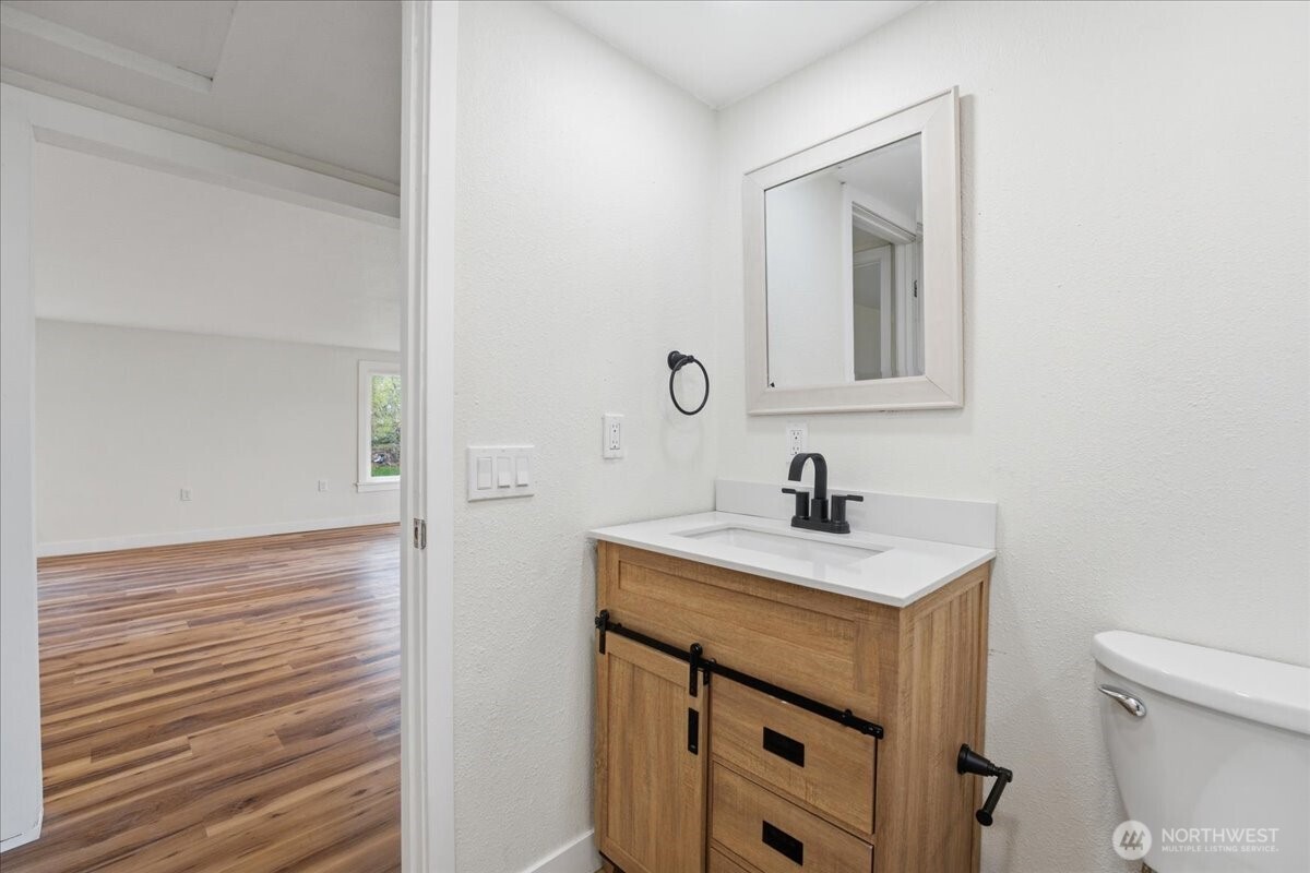 293 Barkley Road Manson, WA 98831 - Photo 21 of 40 a bathroom with a sink vanity and a toilet