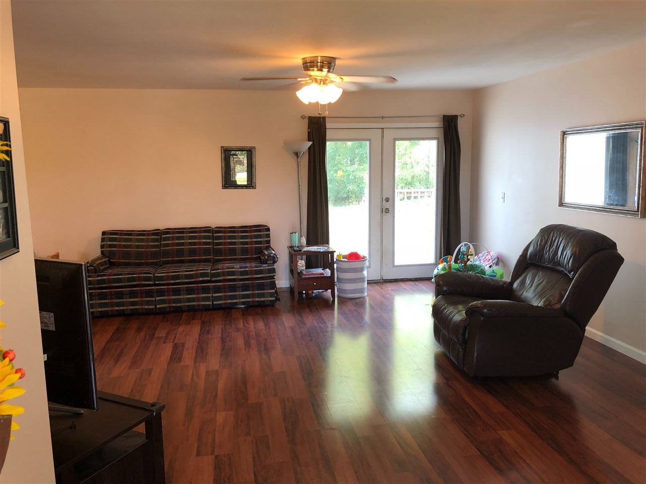 11187 Brittsville Road Georgetown, TN 37336 - Photo 8 of 19 a living room with furniture and a chandelier