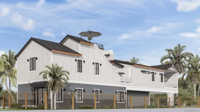 a front view of a house with a tree