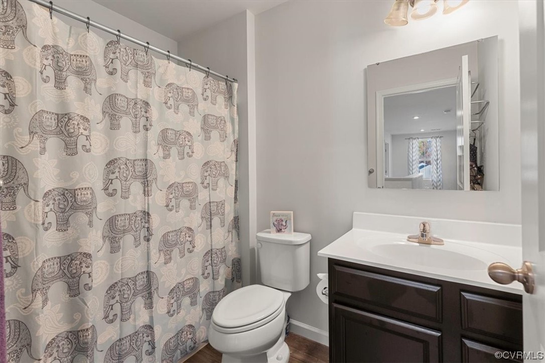 8443 Evening Star Place Richmond, VA 23235 - Photo 17 of 33 a bathroom with a sink toilet and shower