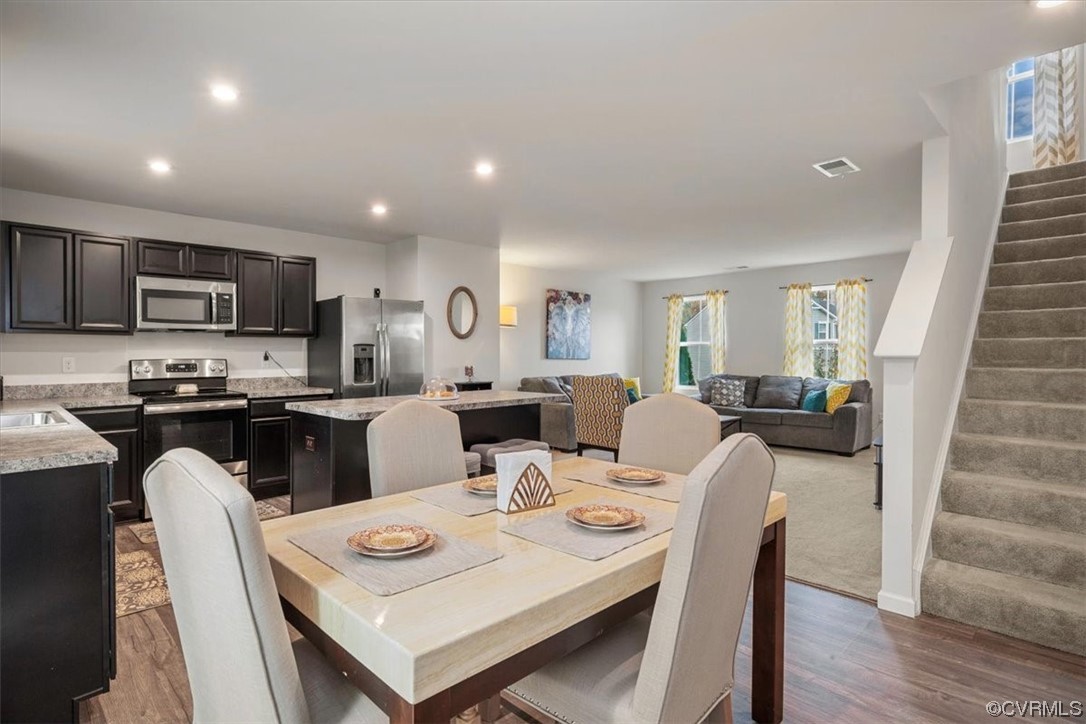 8443 Evening Star Place Richmond, VA 23235 - Photo 19 of 33 a living room with furniture and a wooden floor