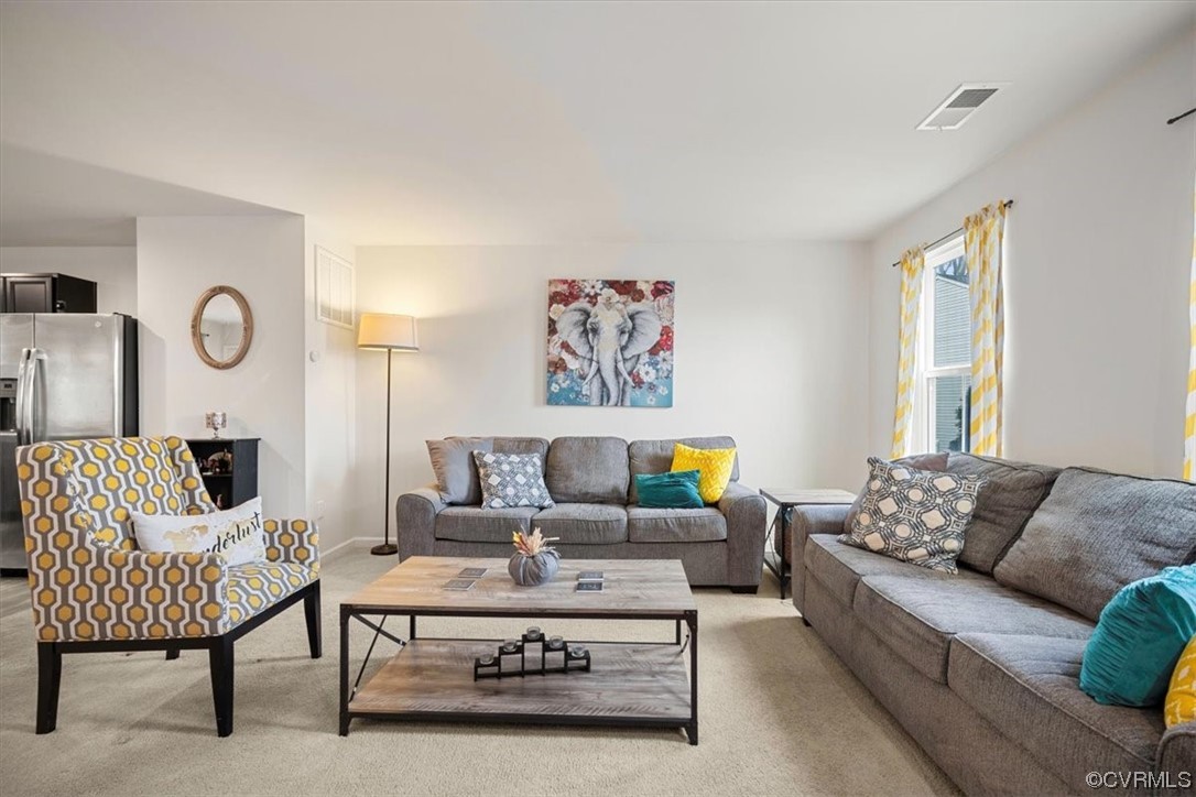 8443 Evening Star Place Richmond, VA 23235 - Photo 2 of 33 a living room with furniture and a large window