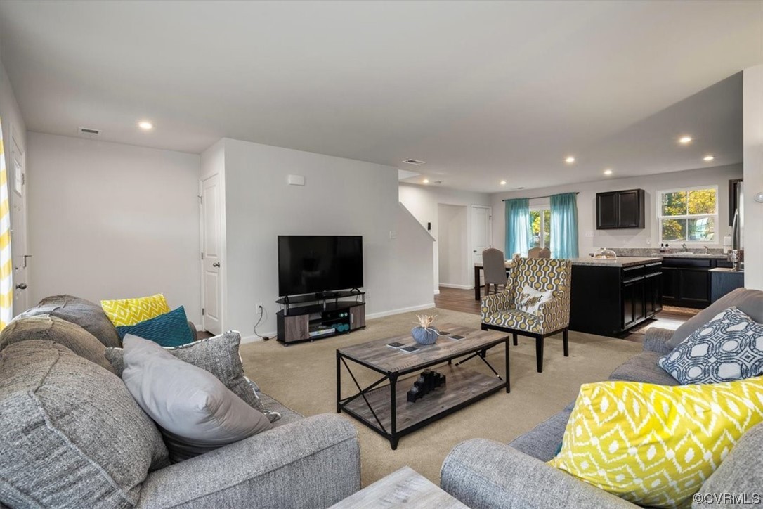 8443 Evening Star Place Richmond, VA 23235 - Photo 21 of 33 a living room with furniture and a flat screen tv