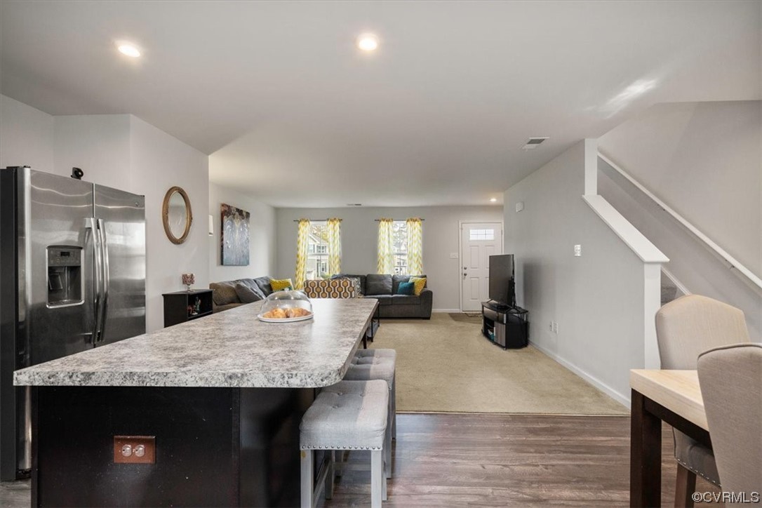 8443 Evening Star Place Richmond, VA 23235 - Photo 22 of 33 a large kitchen with a table and chairs