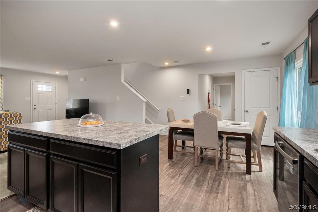 8443 Evening Star Place Richmond, VA 23235 - Photo 23 of 33 a kitchen with a table and chairs in it