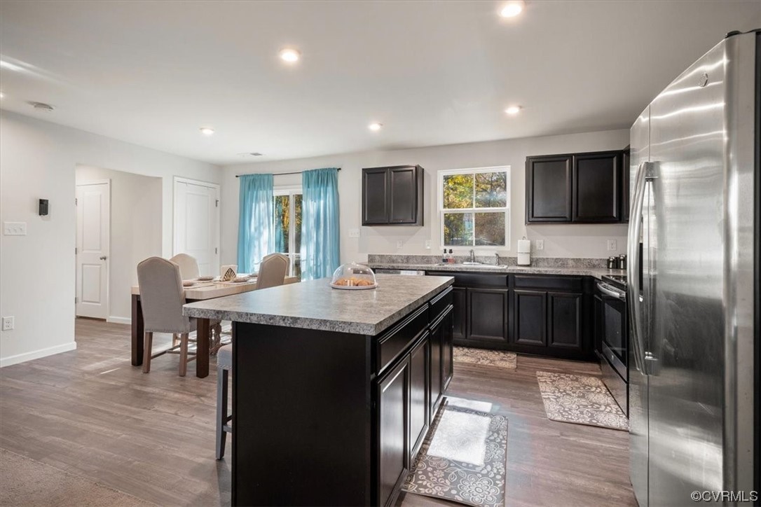 8443 Evening Star Place Richmond, VA 23235 - Photo 24 of 33 a kitchen with granite countertop a sink appliances and cabinets