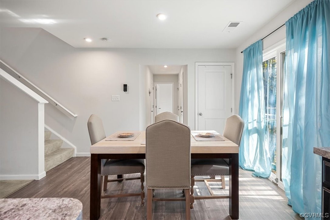 8443 Evening Star Place Richmond, VA 23235 - Photo 26 of 33 a view of a dining room with furniture and wooden floor