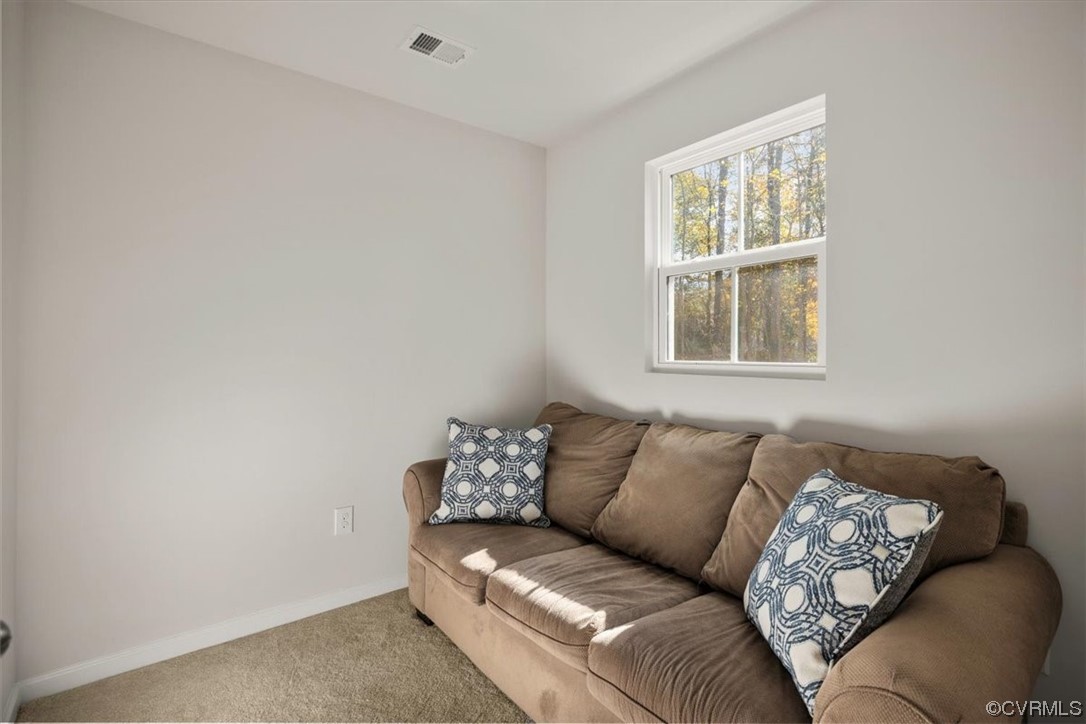 8443 Evening Star Place Richmond, VA 23235 - Photo 29 of 33 a living room with furniture and a window