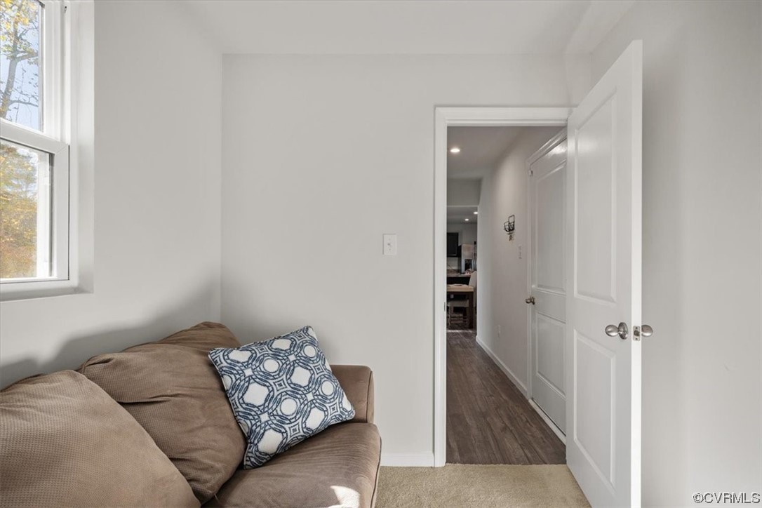 8443 Evening Star Place Richmond, VA 23235 - Photo 30 of 33 a living room with furniture and a window