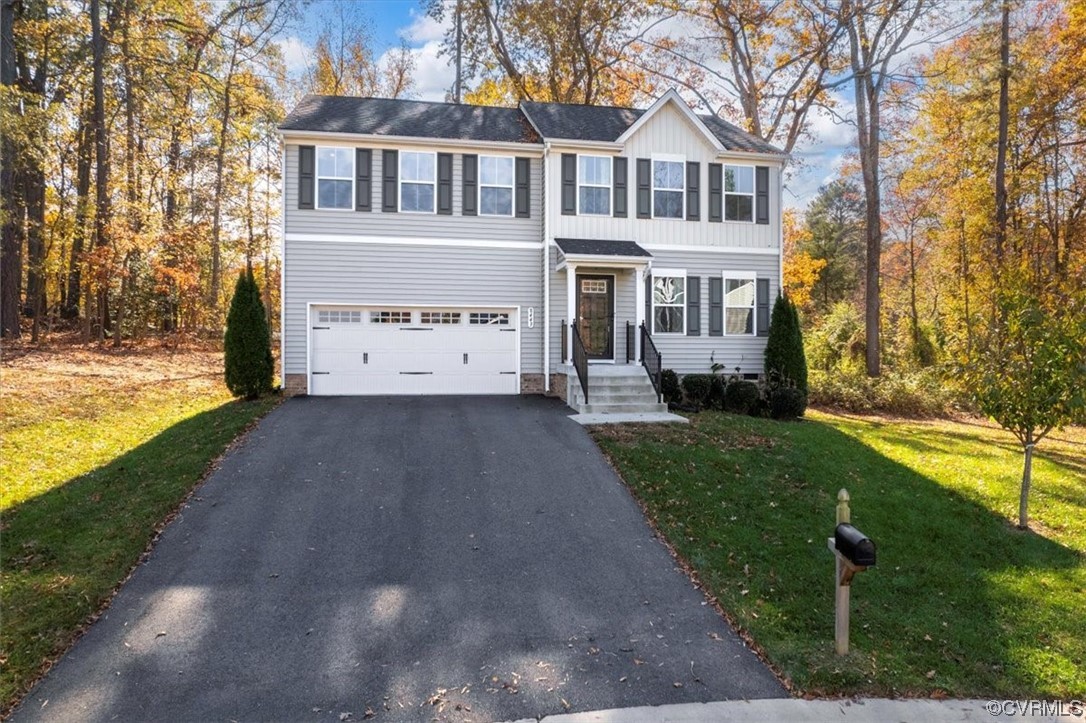 8443 Evening Star Place Richmond, VA 23235 - Photo 33 of 33 a view of house with garden space and sitting area