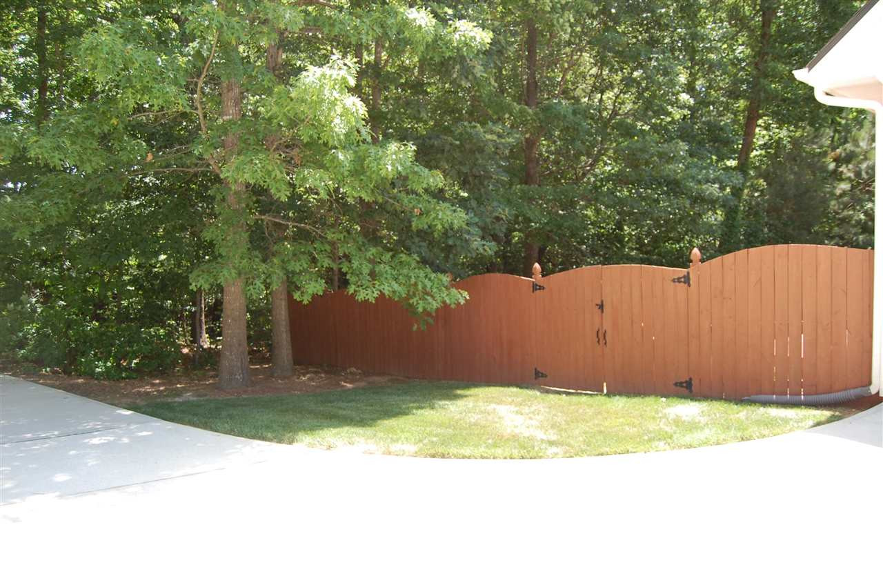 840 Nowell Ridge Road Raleigh, NC 27607 - Photo 24 of 25 View of exterior of fence on parking pad/garage side! Exterior Back