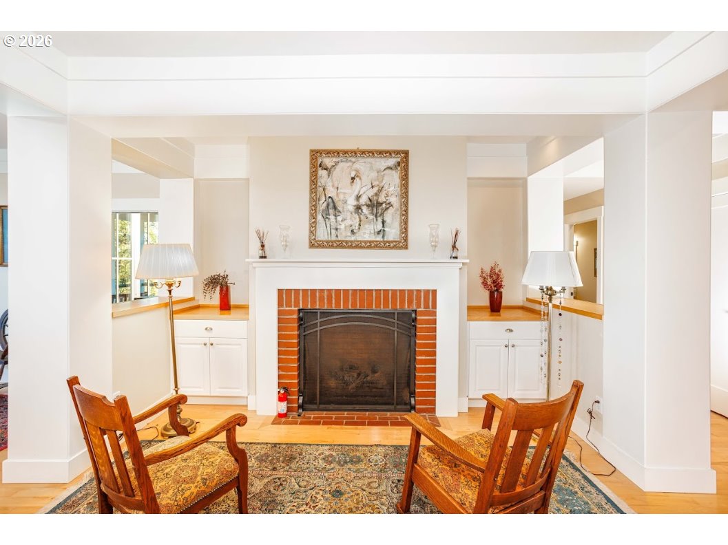 787 South Sunset Lane Ridgefield, WA 98642 - Photo 13 of 43 a living room with furniture a fireplace and a window