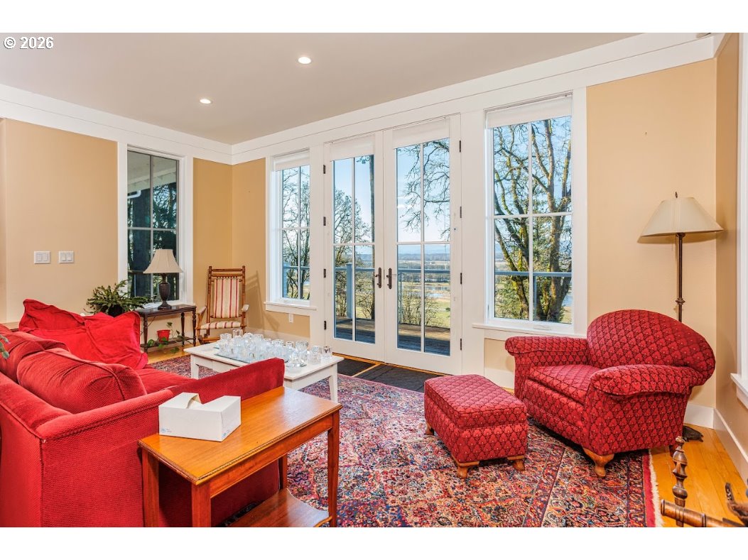 787 South Sunset Lane Ridgefield, WA 98642 - Photo 20 of 43 a living room with furniture and a floor to ceiling window