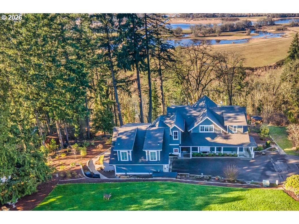 787 South Sunset Lane Ridgefield, WA 98642 - Photo 2 of 43 an aerial view of a house with a yard