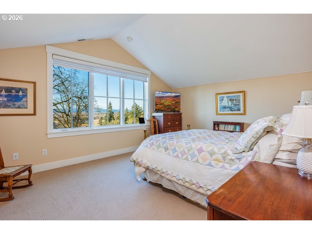 787 South Sunset Lane Ridgefield, WA 98642 - Photo 27 of 43 a bedroom with a bed window and painting on the wall