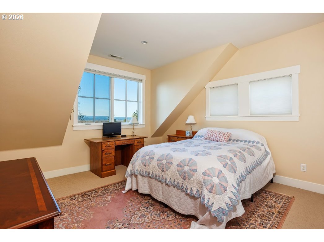 787 South Sunset Lane Ridgefield, WA 98642 - Photo 35 of 43 a bed sitting in a room next to a window