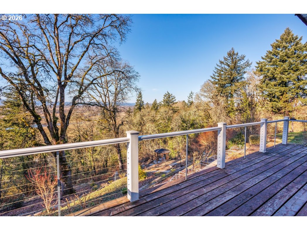 787 South Sunset Lane Ridgefield, WA 98642 - Photo 9 of 43 a view of a balcony with wooden floor and fence