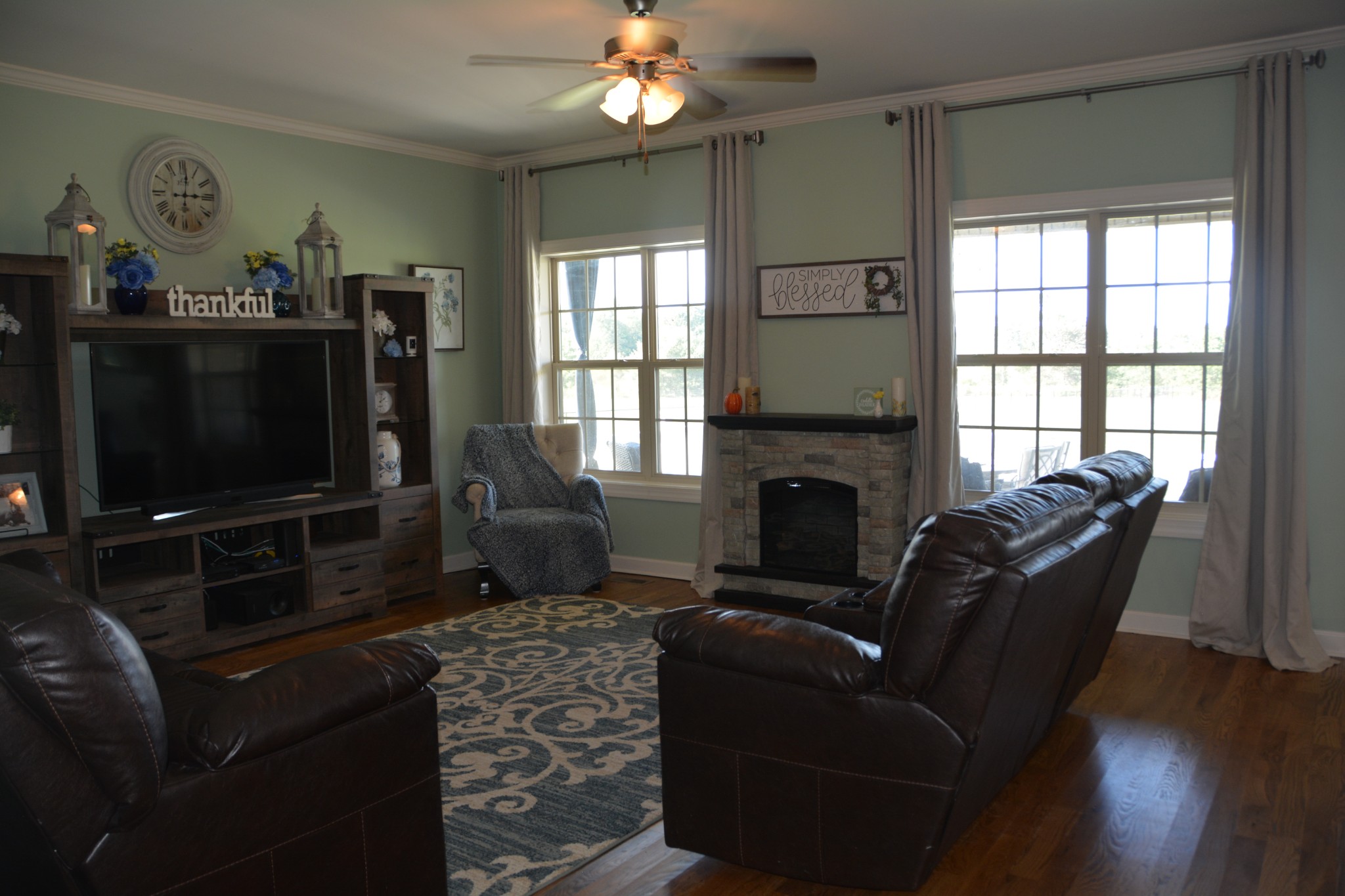675 Elrod Road Manchester, TN 37355 - Photo 15 of 39 a living room with furniture a flat screen tv and a fireplace