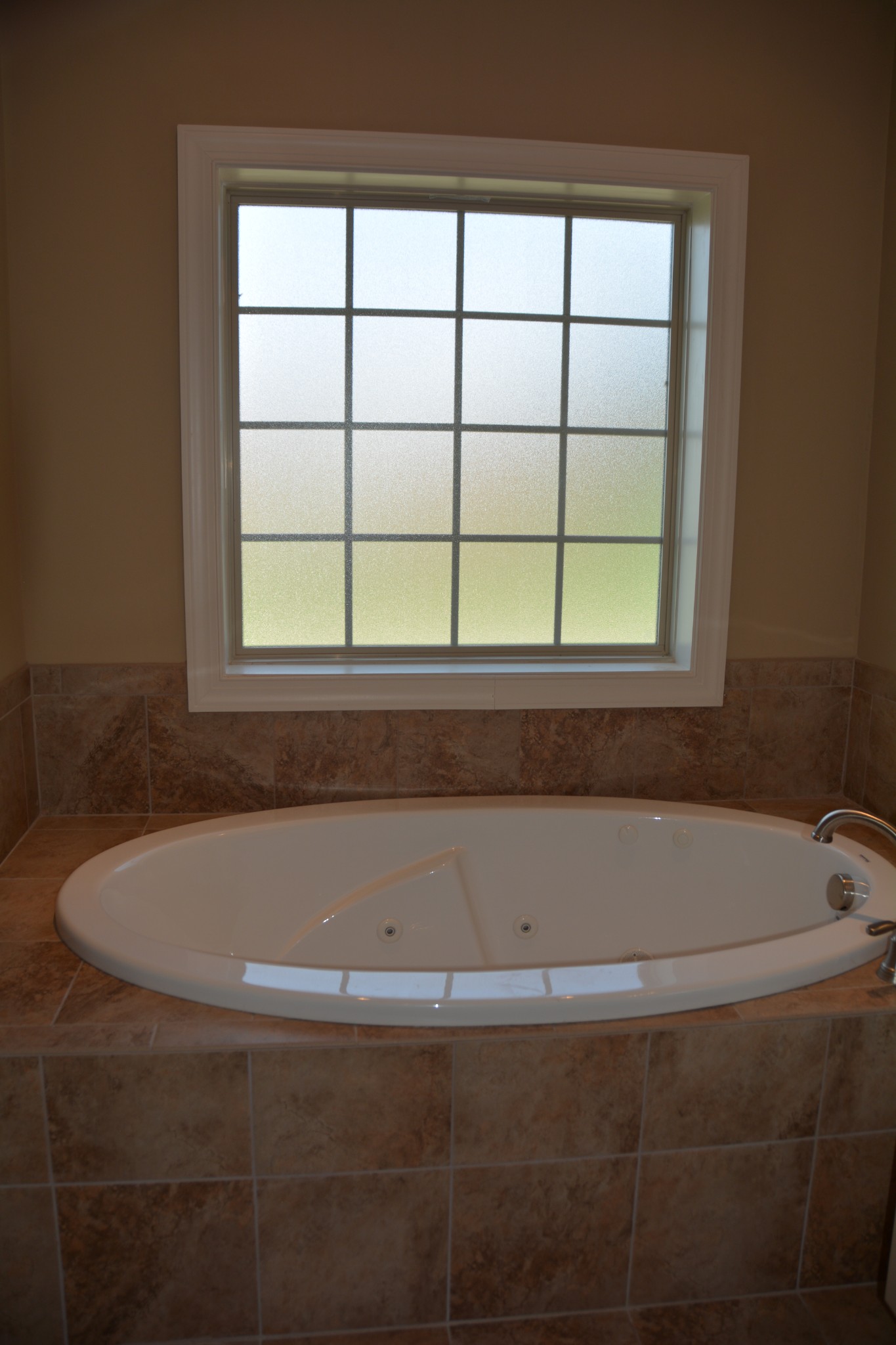 675 Elrod Road Manchester, TN 37355 - Photo 30 of 39 a bath tub sitting in a bathroom next to a window