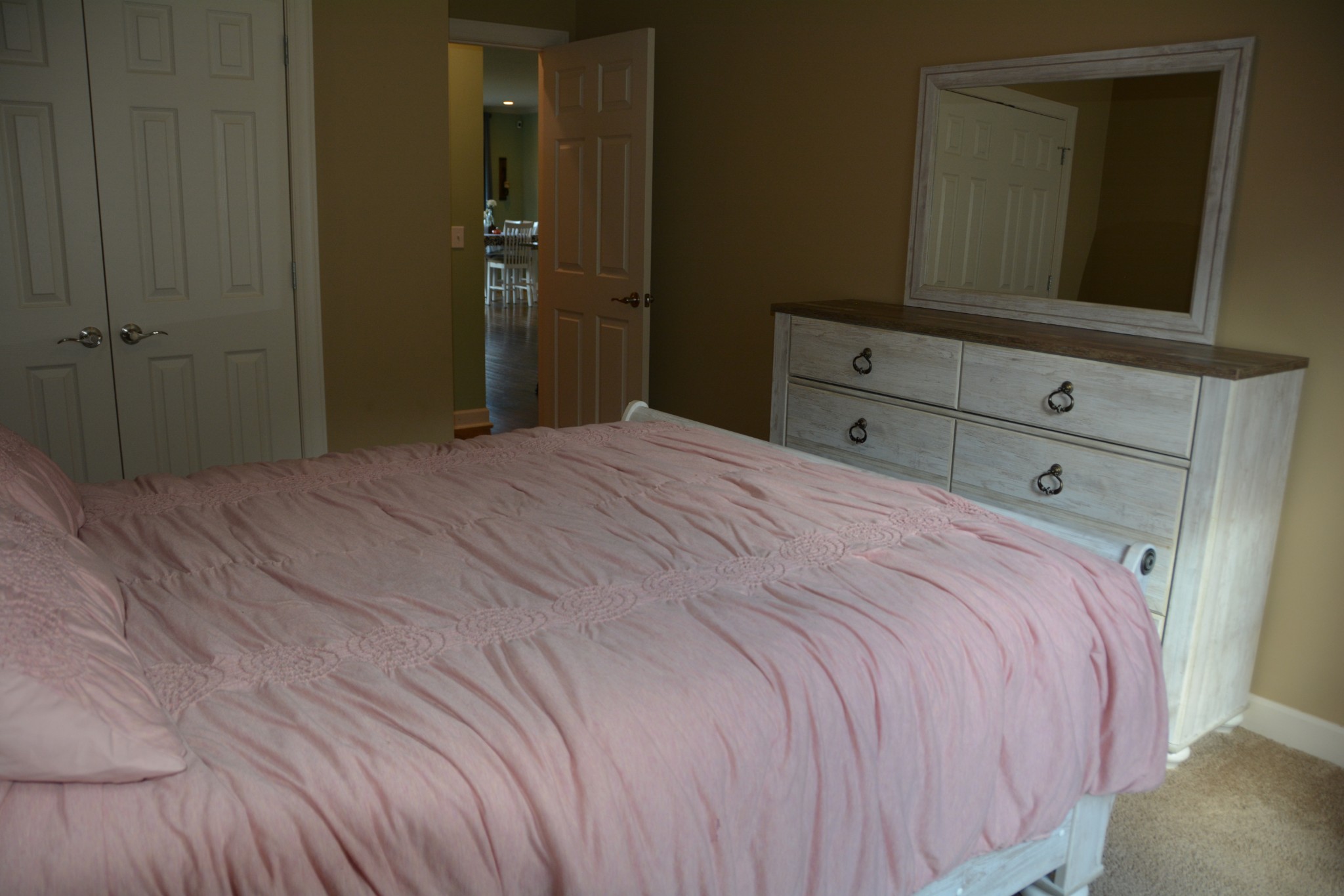 675 Elrod Road Manchester, TN 37355 - Photo 33 of 39 a bedroom with a bed and a mirror on dresser