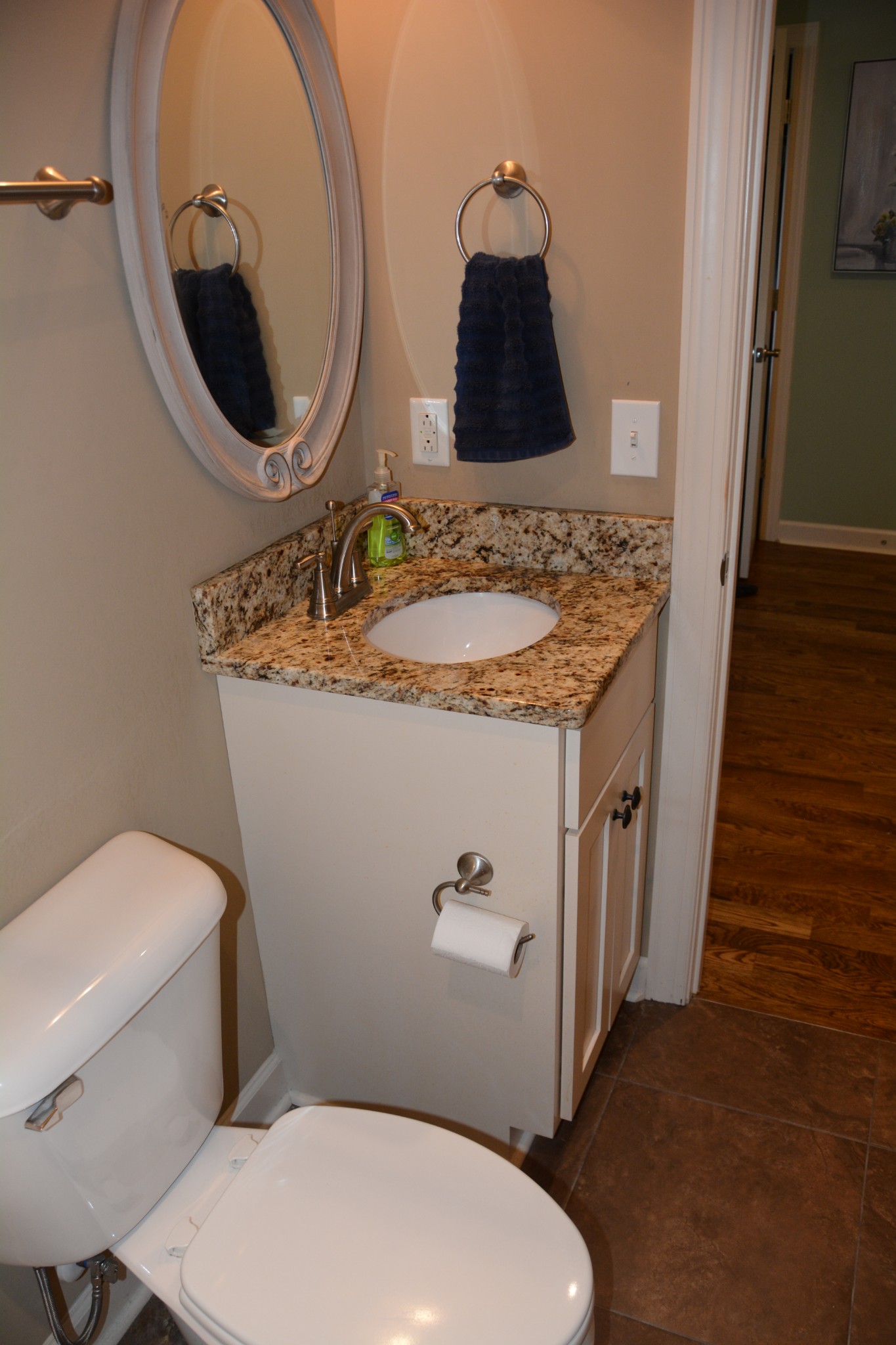 675 Elrod Road Manchester, TN 37355 - Photo 35 of 39 a bathroom with a granite countertop toilet sink and mirror