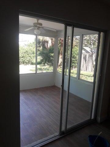 721 Southeast Stypmann Boulevard Stuart, FL 34994 - Photo 5 of 9 a view of an empty room and window