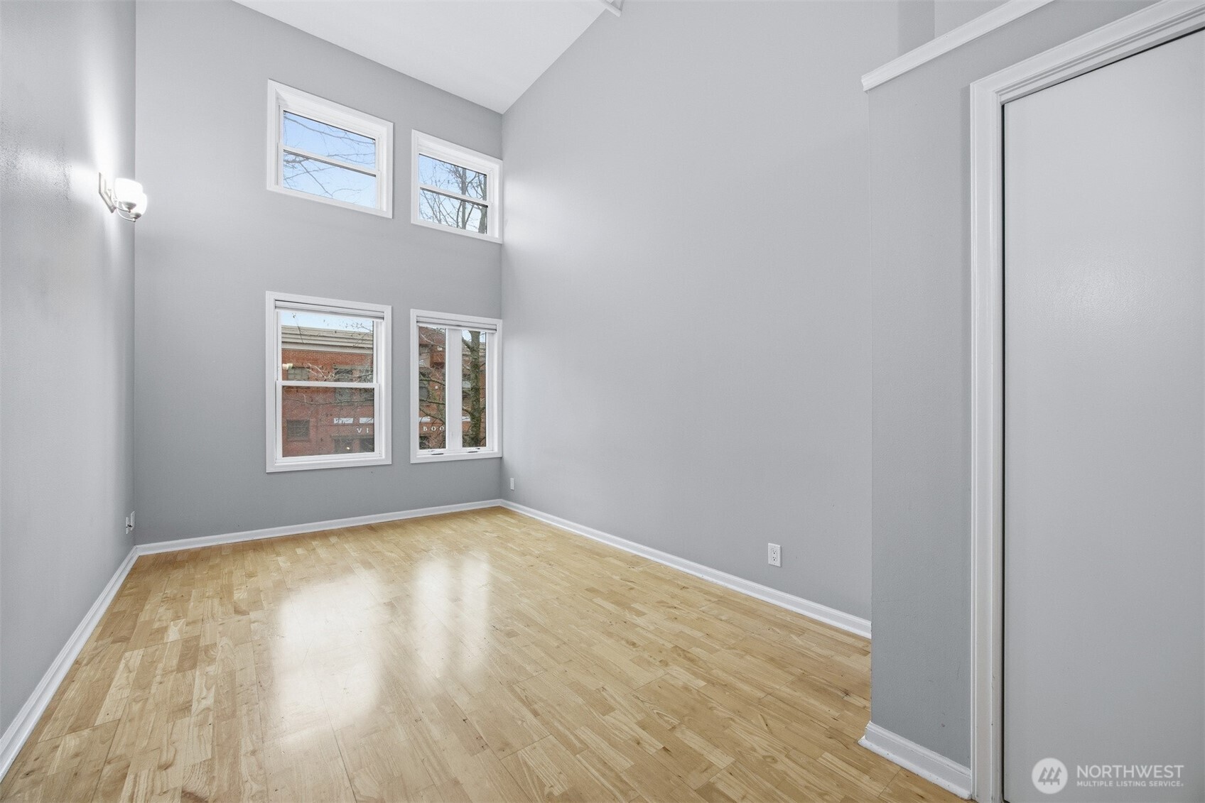 1201 11th Street, Unit 303 Bellingham, WA 98225 - Photo 12 of 34 a view of an empty room with wooden floor and a window