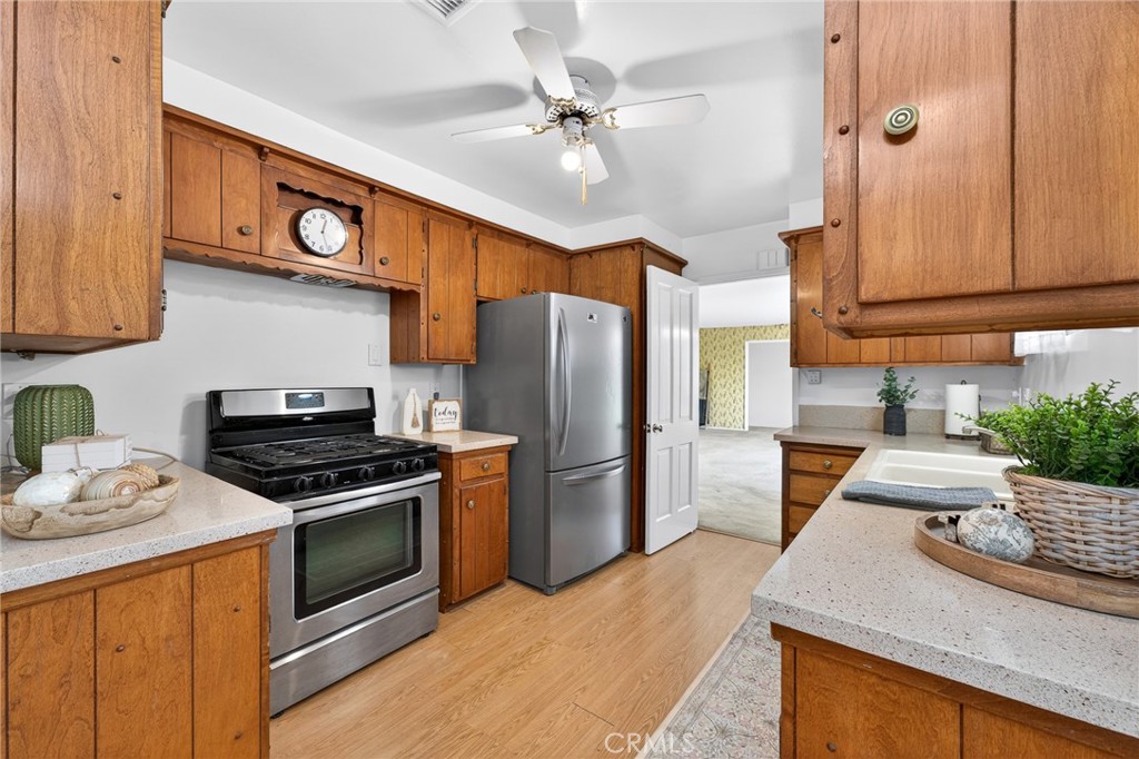 977 North Riverside Avenue Rialto, CA 92376 - Photo 11 of 39 Kitchen beautiful real wood cabinets, notice the detail over the stove