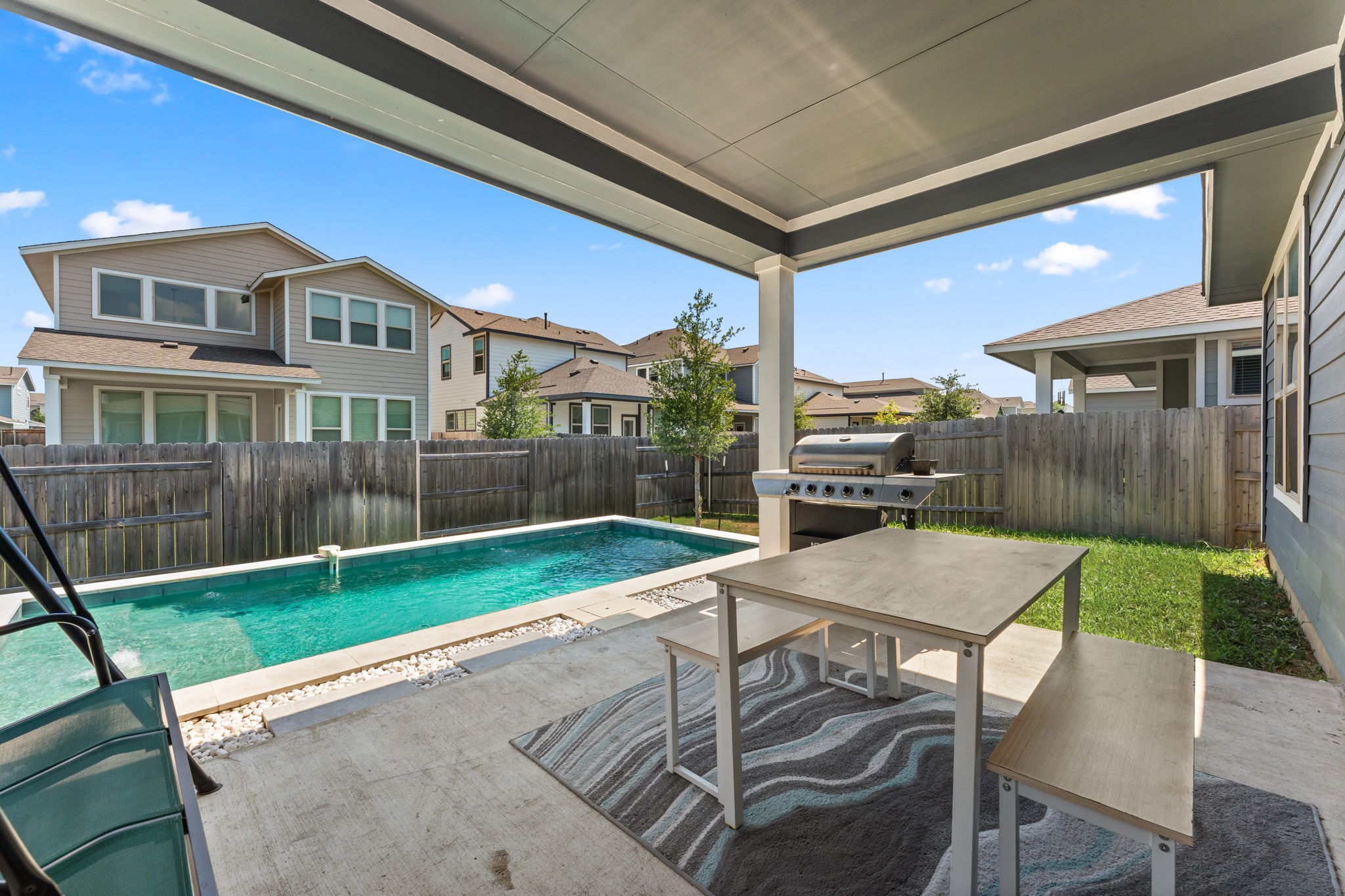 8512 McKamy Drive Austin, TX 78744 - Photo 27 of 28 The covered patio is ideal for outdoor dining or relaxing in the shade.