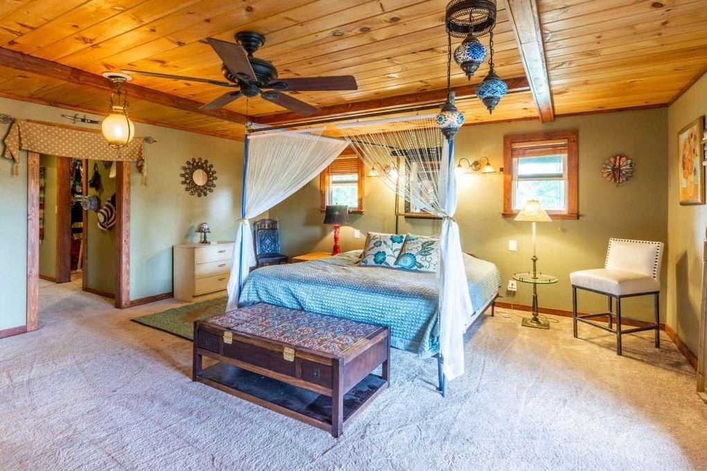 68 Dorr Spring Spring City, TN 37381 - Photo 15 of 42 a bedroom with furniture and a chandelier