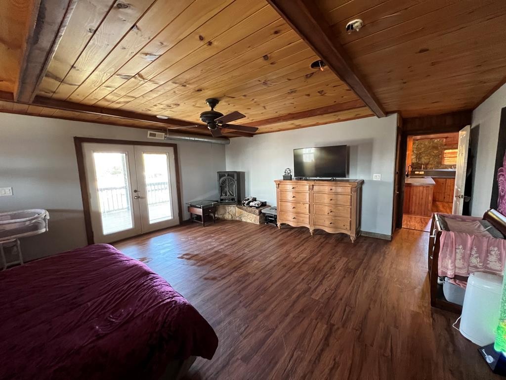 68 Dorr Spring Spring City, TN 37381 - Photo 42 of 42 a spacious bedroom with a bed and wooden floor