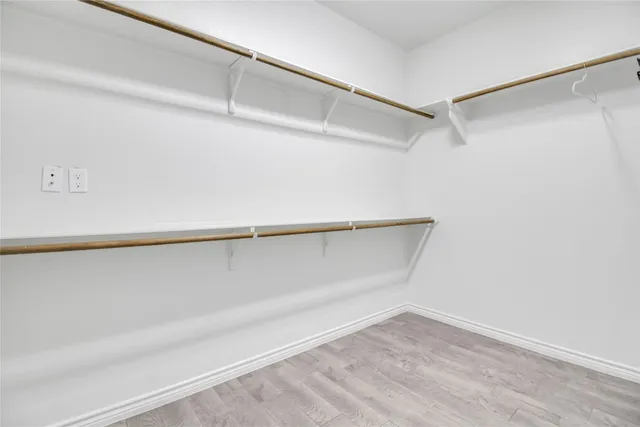 a view of an empty walk in closet