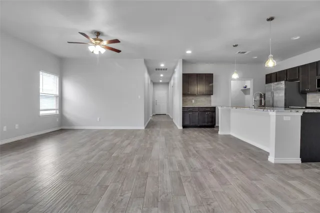 a view of a kitchen with a sink and a microwave