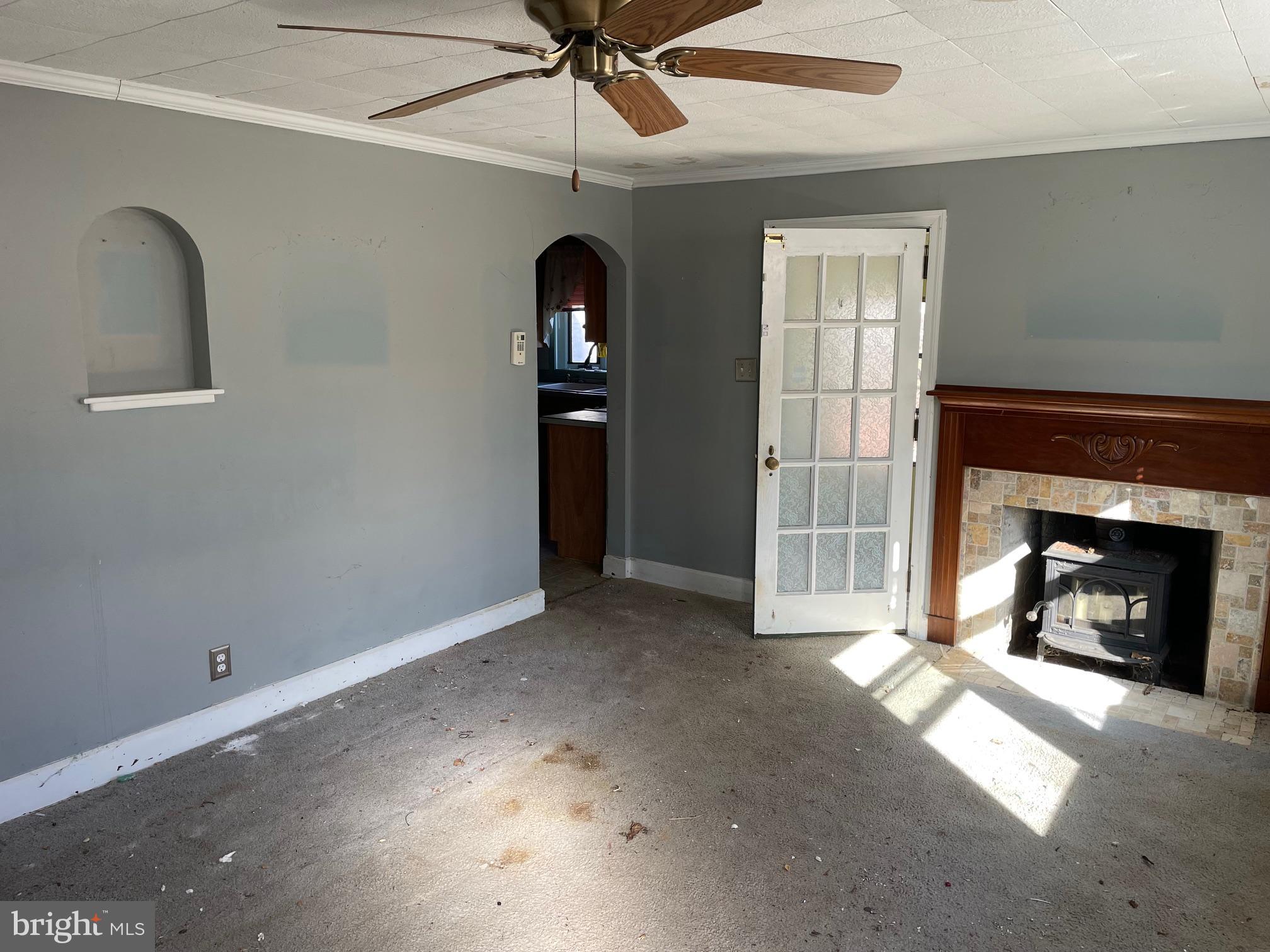 1306 West Orvilla Road Hatfield, PA 19440 - Photo 11 of 14 an empty room with windows and fireplace