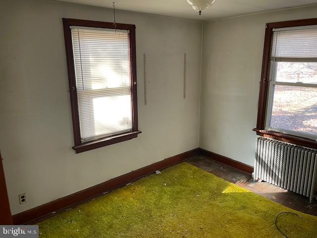 1306 West Orvilla Road Hatfield, PA 19440 - Photo 12 of 14 an empty room with a window and stairs