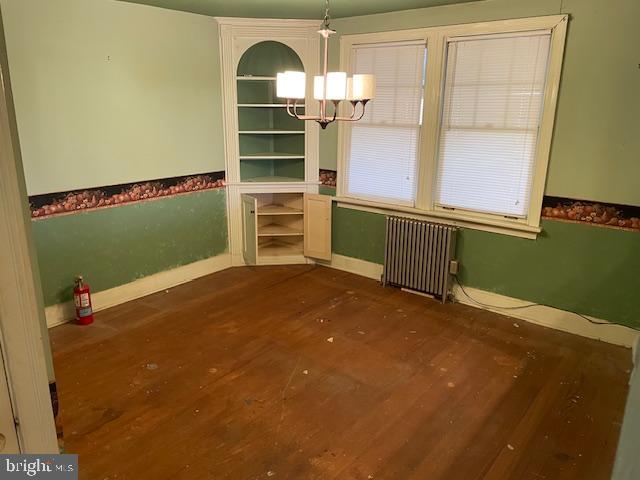 1306 West Orvilla Road Hatfield, PA 19440 - Photo 7 of 14 a view of a room with shelves windows and wooden floor