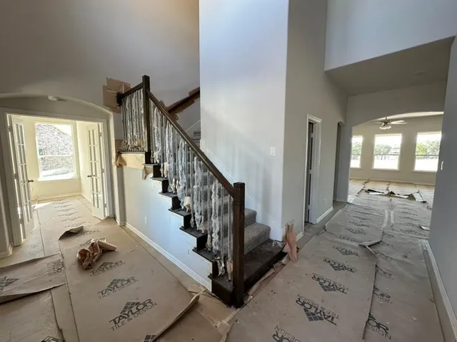 a view of entryway and hall with wooden floor