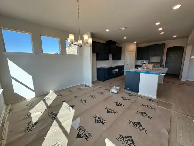 a kitchen with a sink and a refrigerator