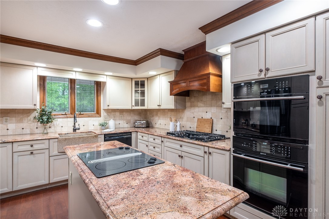 273 North Alpha Bellbrook Road Dayton, OH 45434 - Photo 14 of 43 This spacious kitchen offers ample countertop space and modern appliances for culinary endeavors.