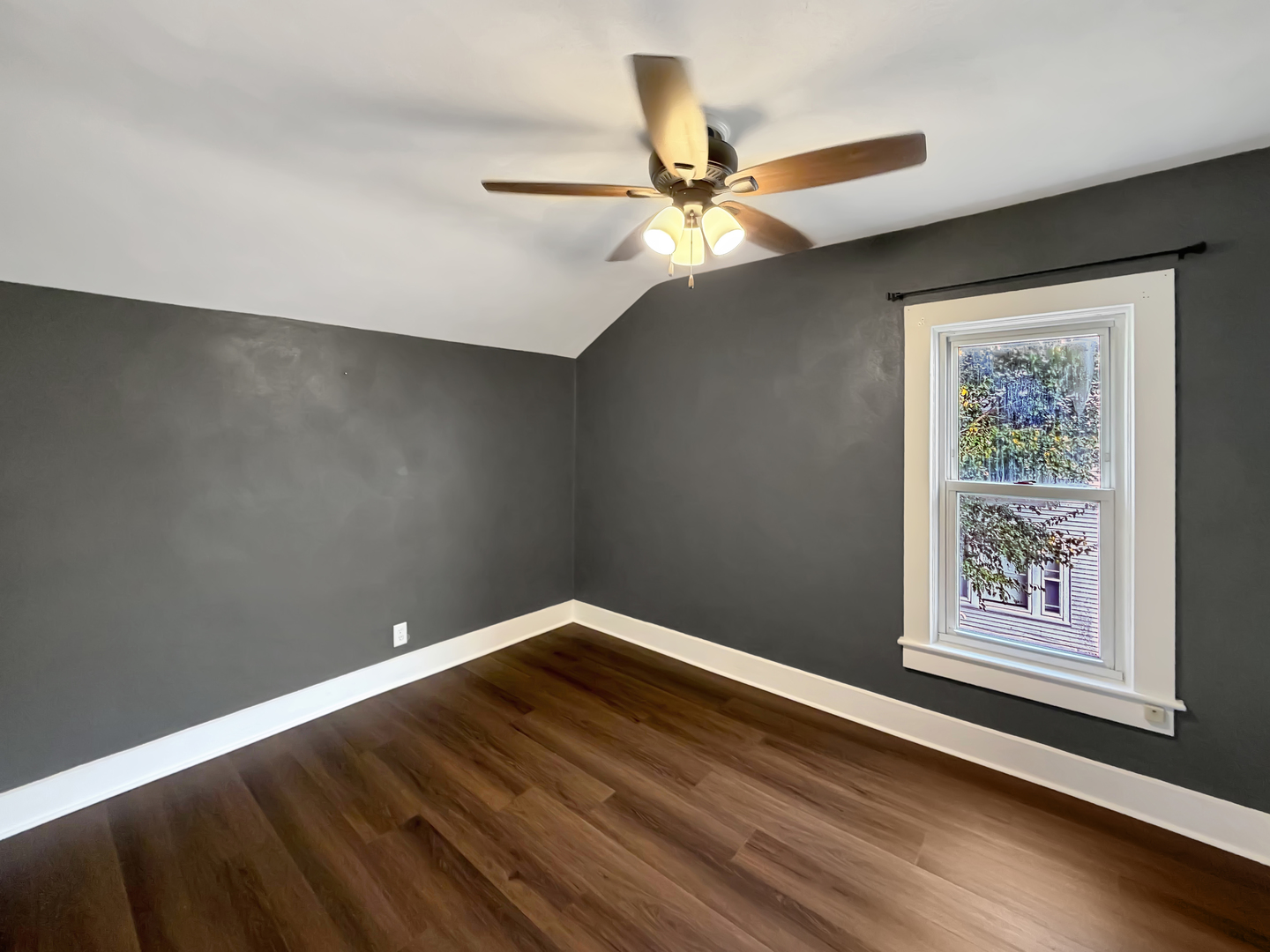 840 West Homer Street Freeport, IL 61032 - Photo 20 of 23 an empty room with wooden floor fan and windows