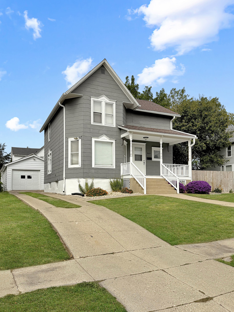 840 West Homer Street Freeport, IL 61032 - Photo 23 of 23 a front view of a house with a garden and porch