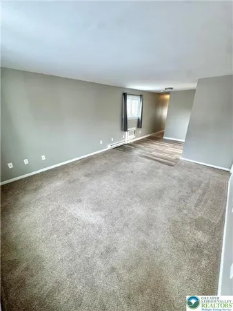 a view of an empty room with window